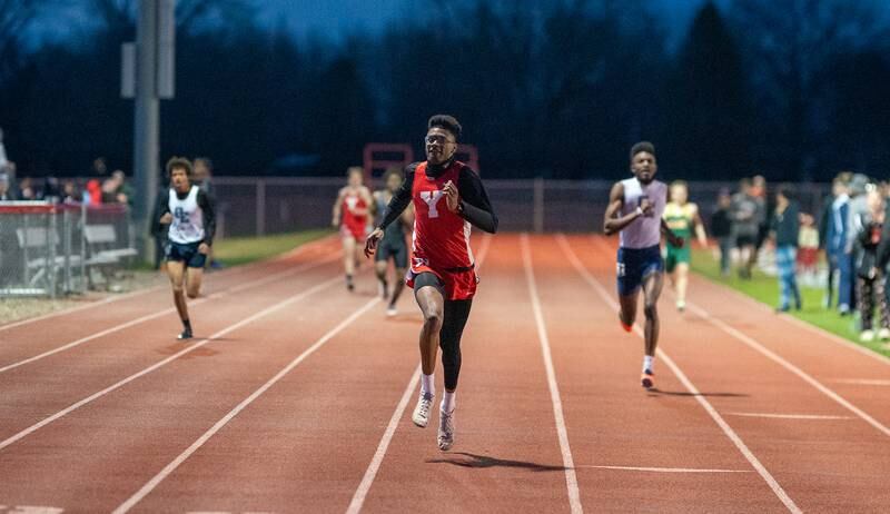 Yorkville’s Josh Pugh takes first place in the 400-meter race during the Matt Wulf Invitational track and field meet at Yorkville High School on Thursday, April 14, 2022.
