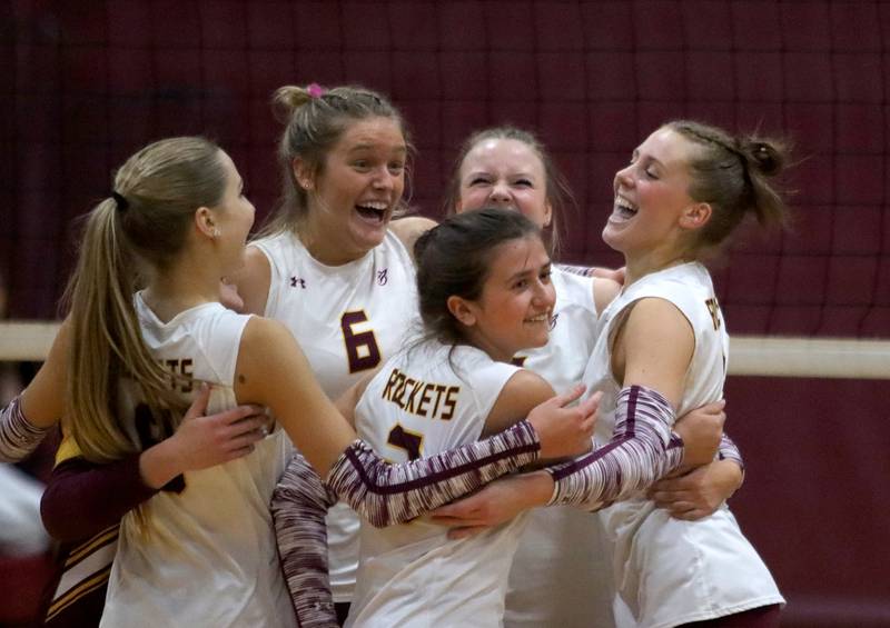 Richmond-Burton’s Rockets celebrate a two-set win over Genoa-Kingston in IHSA Class 2A Regional Title Game volleyball action on Thursday, Oct. 31, 2024, at  Marengo High School  in Marengo.