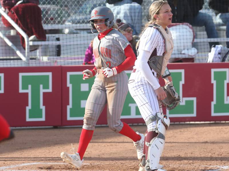 L-P's Karmen Piano scores the teams first run as Morris catcher McKenna Gliwa waits for the late throw on Monday, April 7, 2025 at the L-P Athletic Complex in La Salle.