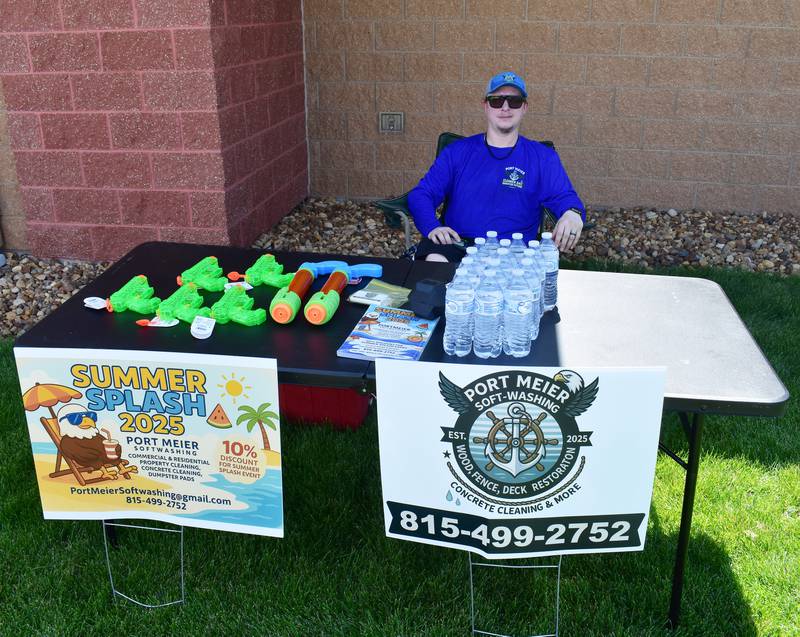 Brandon Meier hands out squirt guns from his booth Saturday, June 21, 2025, at Summer Splash in Rock Falls.