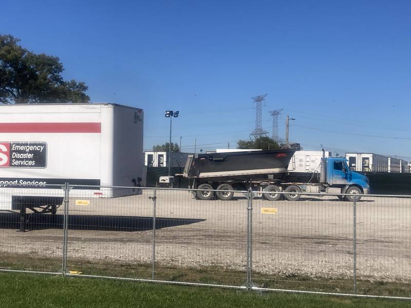 A dump truck prepares to dump gravel in the lot of the Army Reserve Training Center.
Thursday, Oct. 9, 2025.