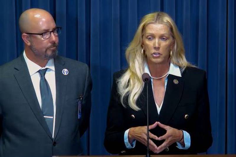 State Sen. Sue Rezin (R-Morris) speaks as state Rep. Lance Yednock (D-Ottawa) looks on during a news conference Thursday, Nov. 9, 2023, in Springfield. Lawmakers on Thursday approved a proposal that would allow companies to develop new nuclear power generation in Illinois for the first time since 1987.