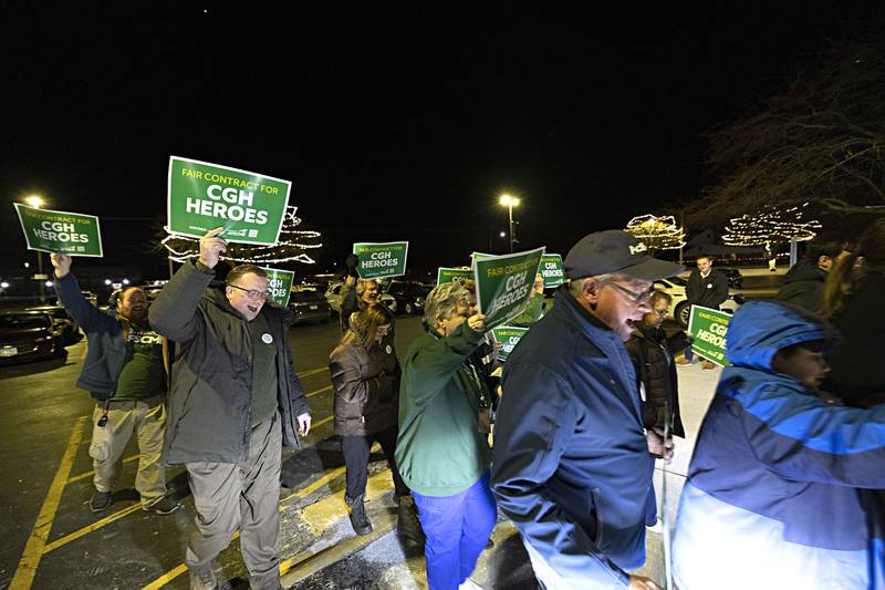 CGH worker supporters march in the parking lot Tuesday, Nov. 28, 2023 ahead of the night’s board meeting.