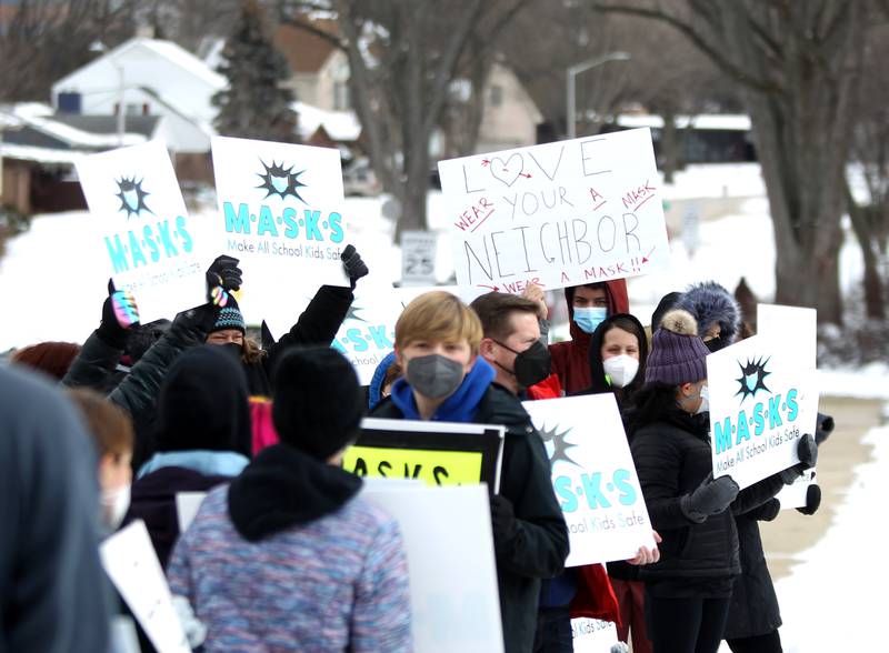 Parents who are in favor of continuing to require masks in schools rallied outside Community Unit School District 200 headquarters in Wheaton on Monday, Feb. 7, 2022. The rally was organized by the group M.A.S.K.S., which stands for Make All School Kids Safe.