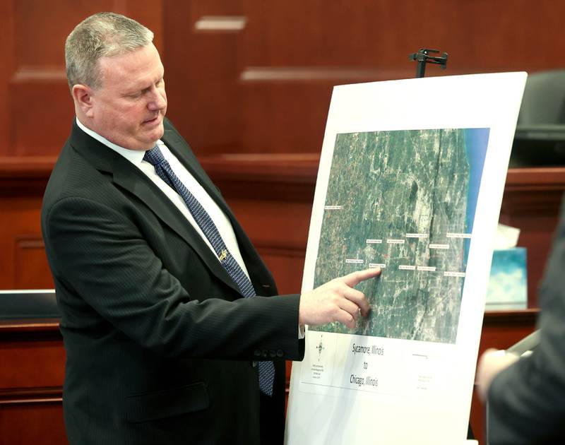 Retired DeKalb County sheriff's Detective John Holiday points out locations on a map Monday, Jan. 27, 2025, which detailed the route a stolen car owned by Patricia Wilson traveled on from Sycamore to Chicago. Jonathan D. Hurst is charged in the 2016 slaying of Sycamore residents Patricia and Robert Wilson. His trial entered its third day Monday.