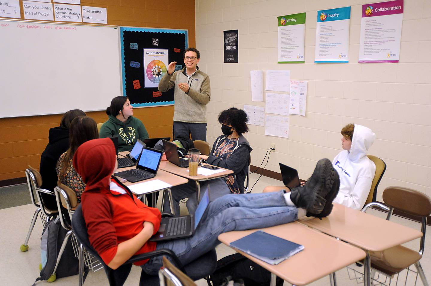 Teacher John Liuzzi talks about a college research project with his students Wednesday, March 23, 2022, as he teaches the Advancement Via Individual Determination, or AVID, class for freshmen at Woodstock North High School.