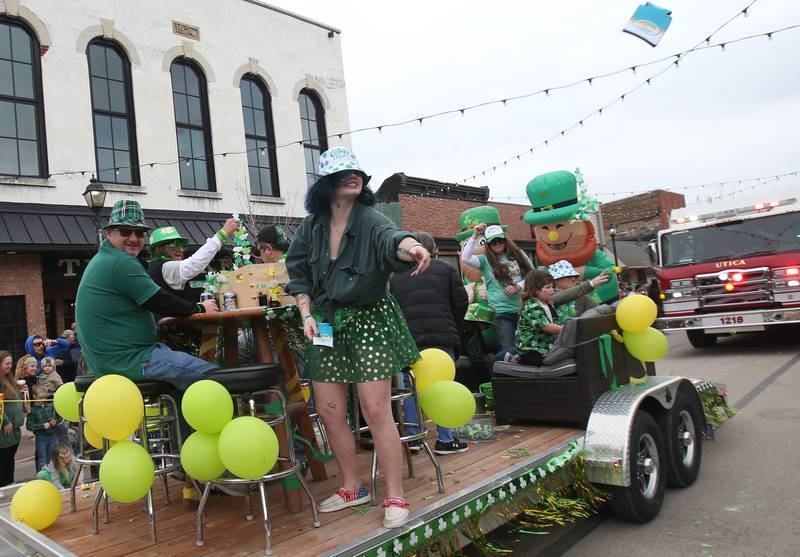 A crew with Jamie's OutPost travels on a float during the St. Patrick's Day parade on Saturday, March 15, 2025 downtown Utica.