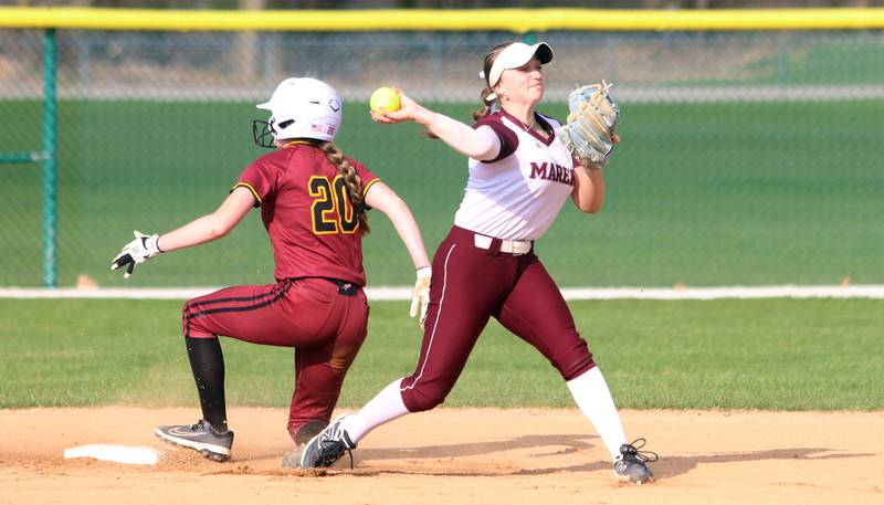 Richmond-Burton’s  Lilly Kwapniewski, left, is forced at second base by Marengo’s Gabby Christopher in varsity softball on Tuesday, April 22, 2025, at Marengo High School in Marengo.