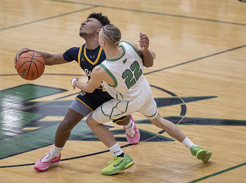 Sterling’s Kaedon Phillips and Rock Falls’ Nehemiah Menendez collide Tuesday, Nov. 28, 2023 in Rock Falls.