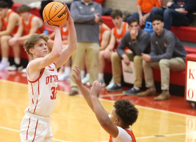 Ottawa's Aric Threadgill hits a jump shot over Pontiac's Riley Johnson during the Dean Riley Shootin' The Rock Thanksgiving Tournament on Monday, Nov. 25, 2024 in Kingman Gym at Ottawa High School.