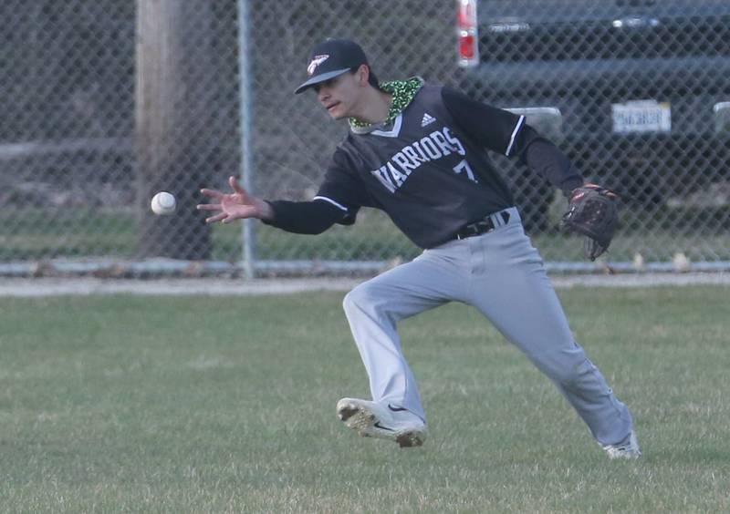 Woodland/Flanagan-Cornell's Eric Miramontes bare hands a ground ball on Wednesday, March 27, 2024 at Masinelli Field in Ottawa.