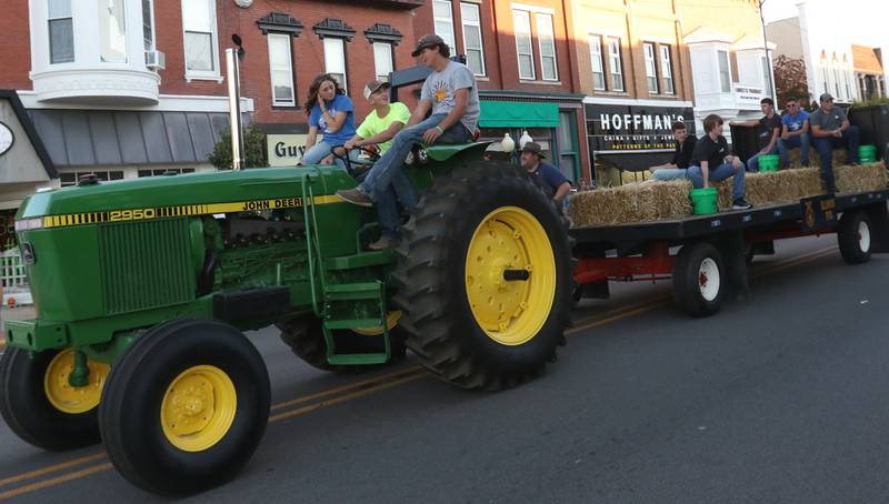 The Princeton High School FFA rides a tractor during the homecoming parade on Thursday, Sept. 25, 2025 along South Main Street in Princeton .