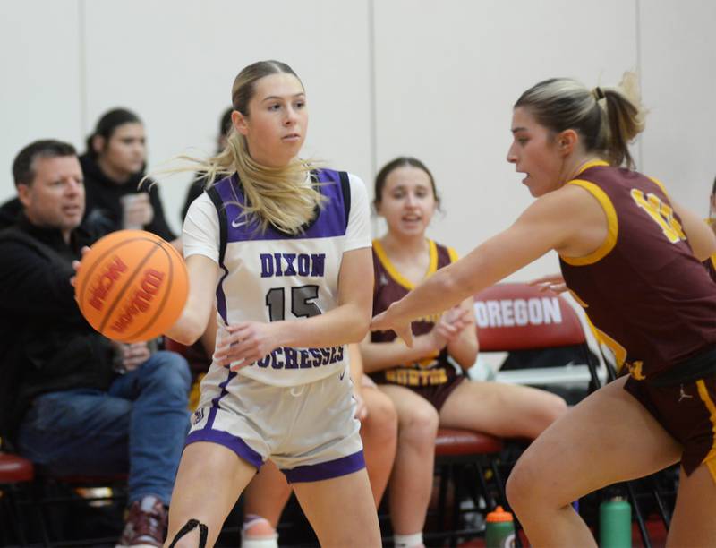 Dixon's Morgan Hargrave (15) looks to pass as Richmond Burton's Daniella Mazzola (10) defends at the Oregon Girls Basketball Tip-Off Tournament on Wednesday, Nov. 20, 2024 at the Blackhawk Center in Oregon.