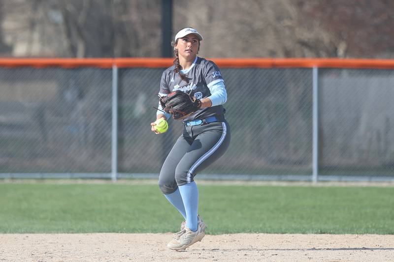Joliet Catholic’s Addy Rizzatto looks the Minooka runner back to first on Tuesday, April 7, 2026 in Minooka.