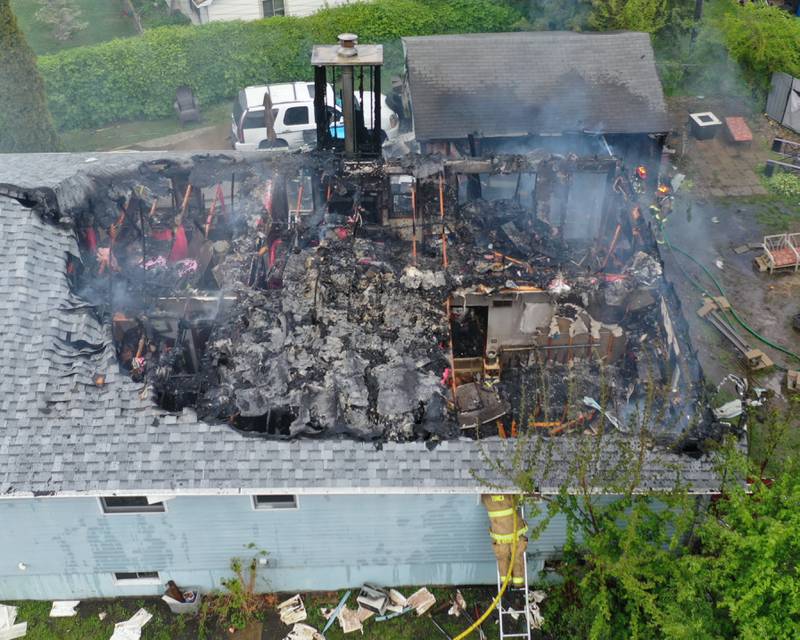 Firefighters work the scene of a structure fire in the 1900 block of Main Street on Monday, May 4, 2026 in Peru.