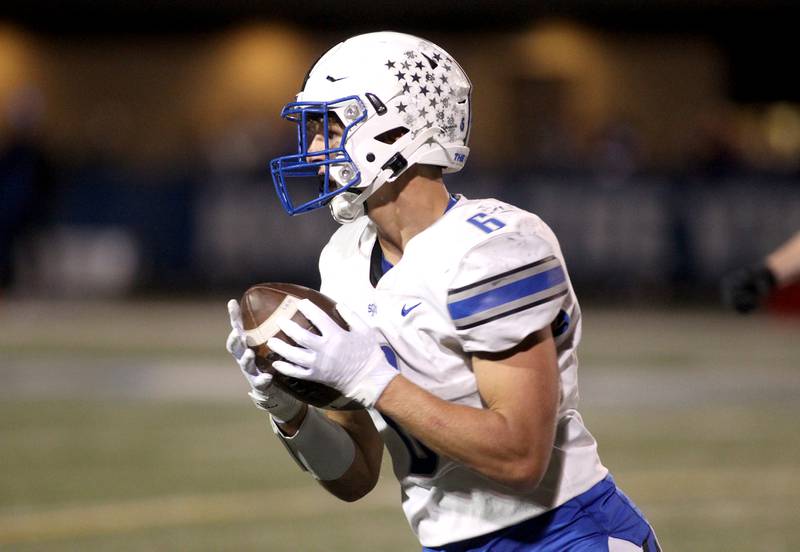 St. Charles North’s Drew Surges intercepts the ball during a game at Geneva on Friday, Sept. 23, 2022.