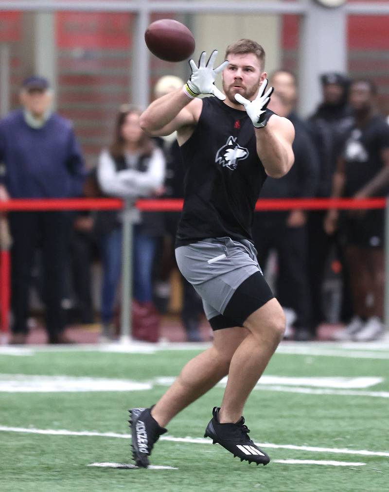 Former Northern Illinois University running back Clint Ratkovich catches a pass Wednesday, March 30, 2022, during pro day in the Chessick Practice Center at NIU. Several NFL teams had scouts on hand to evaluate the players ahead of the upcoming draft.