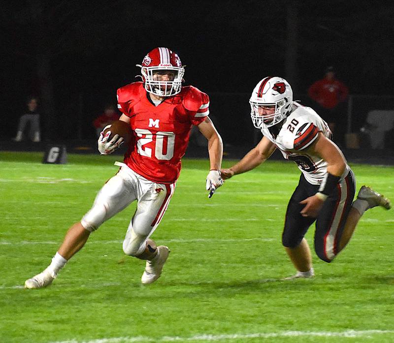 Morrison's Brady Anderson (20) carries the ball as Forreston's Dane Setterstrom pursues him on Friday, Sept. 27, 2024 at Morrison High School.