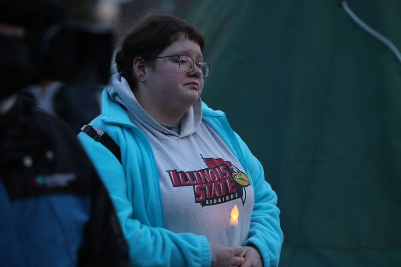 A woman becomes emotional during the candlelight vigil for the victims of the March 5th shooting on Wednesday, March 8th, 2023 in Bolingbrook.