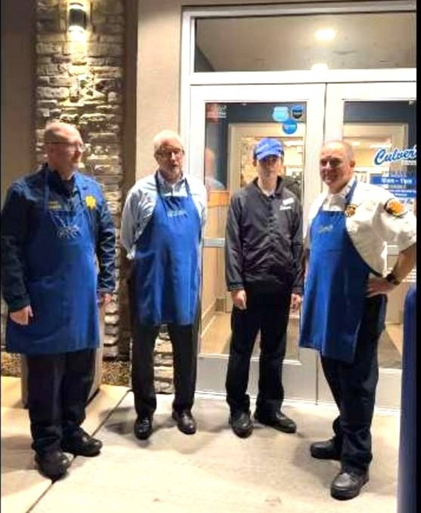 Pictured are volunteers who worked the Culver's fundraiser for  Plano Rockin’ Christmas on Tuesday, Nov. 25,2025. Plano Police Chief Norm Allison, Plano Mayor Mike Rennels, a Culvers representative, and Fire Chief of Little Rock-Fox Fire Protection District Fred Kreinbrink.