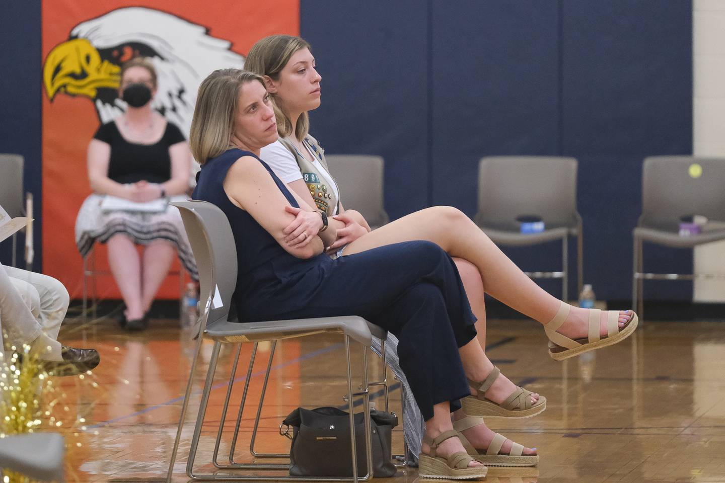 Mikaylah Boulds, of Troop 70891, right, sits with her mother and troop leader Rachel during a Girls Scouts award ceremony. Thursday, May 12, 2022, in Plainfield.