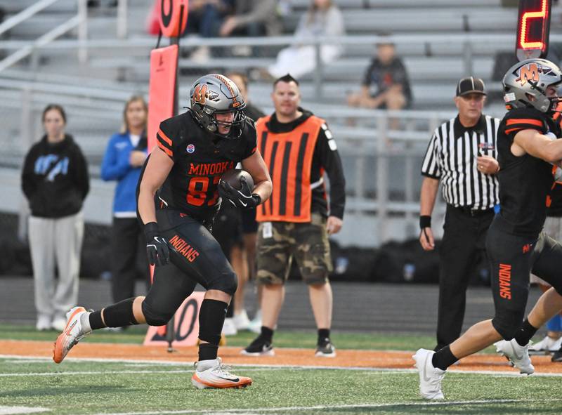 Minooka's Jackson Miranda (87) picks up big yardage after the catch during the non-conference game against St. Charles North on Friday, Aug. 29, 2025, at Minooka.