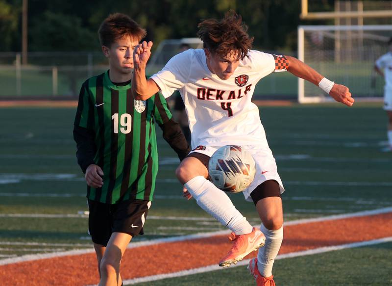DeKalb's Zachariah Murray tries to hold off St. Edward's Omar Garcia Thursday, Aug. 28, 2025, during their game in the Barb Cup tournament at DeKalb High School.
