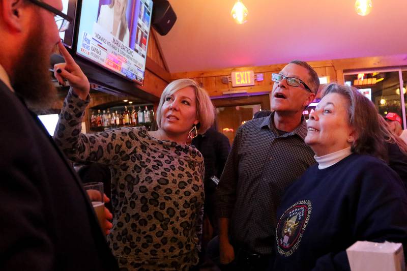 From left: Tyler Wilke talks with Heidi and Mike Buehler and Diane Evertsen during an election night watch party for local republicans at Niko's Red Mill Tavern on Tuesday, Nov. 3, 2020 in Woodstock.