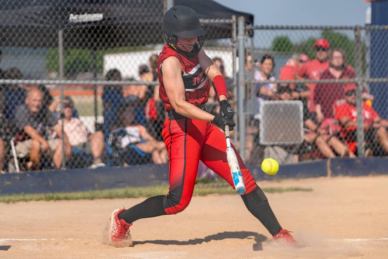 Yorkville's Katlyn Schraeder (12) singles driving in a run against Wheaton Warrenville South during the Class 4A Oswego softball sectional final game between Yorkville and Wheaton Warrenville South at Oswego High School on Friday, June 2, 2023.