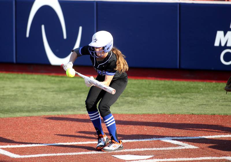 St. Charles North’s Julia Larson bunts to get on first base during their Class 4A Rosemont Supersectional win over Whitney Young on Tuesday, June 7, 2022.