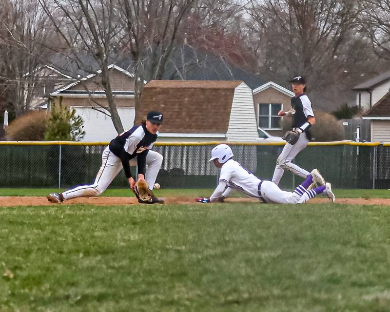 Sandwich's Anthony Wade (6) comes up with a throw while Plano's Amari Bryant (10) slides into second during baseball game between Sandwich at Plano on Thursday, April 9, 2025 in Plano.