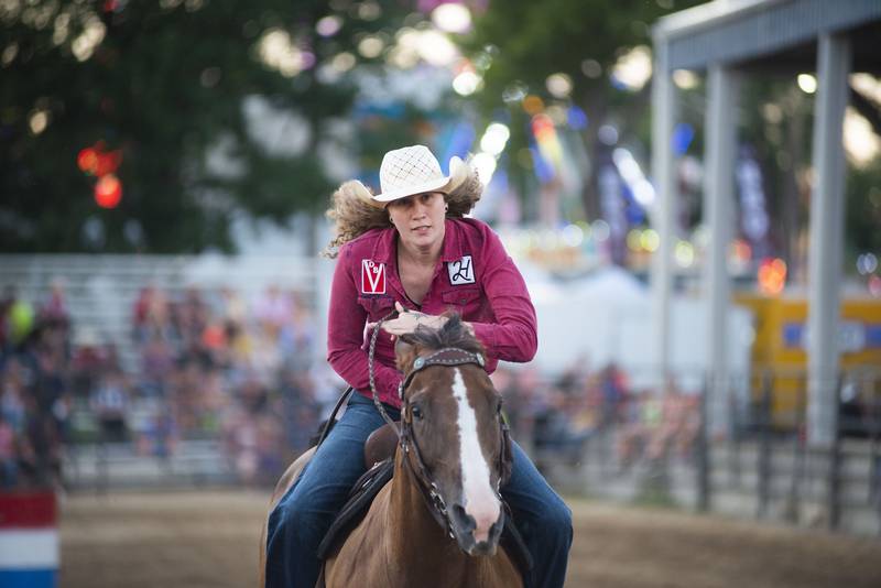 Bailey Franklin hits the straightaway in the barrel racing event Tuesday, August 16, 2022 during the Next Level Bull Riding tour at the Whiteside County fair.