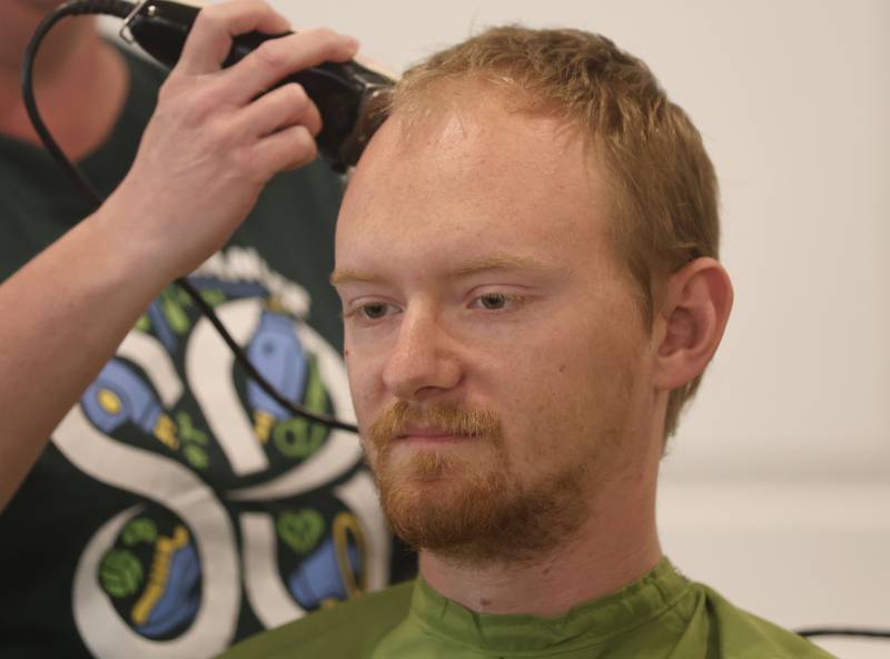 Tonica firefighter and paramedic Jesse Briet has his head shaved during the 19th annual Illinois Valley Emergency Services Annual St. Baldrick's Event on Sunday, March 22, 2026 at Senica's Oak Ridge in La Salle.