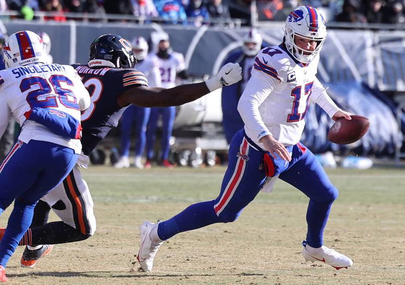 Chicago Bears linebacker Nicholas Morrow flushes Buffalo Bills quarterback Josh Allen out of the pocket during their game Sunday, Dec. 24, 2022, at Soldier Field in Chicago.