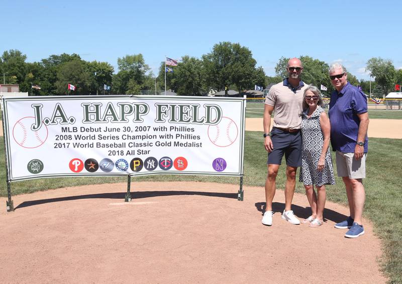 J.A. Happ and his parents Sue and Jim pose for a photo during the J.A. Happ Day and field dedication on Sunday, July 30, 2023 at Washington Park in Peru. during the J.A. Happ Day and field dedication on Sunday, July 30, 2023 at Washington Park in Peru. The new field is renamed after native son and former big leaguer J.A. Happ.