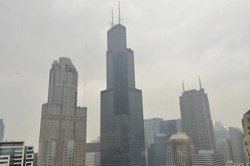 The Willis Tower (formerly Sears Tower) is pictured in downtown Chicago, where the air quality has been categorized "unhealthy" by the U.S. Environmental Protection Agency, on Tuesday, June 27, 2023. Drifting smoke from the ongoing wildfires across parts of Canada is contributing to air quality concerns throughout the Great Lakes region. (AP Photo/Claire Savage)