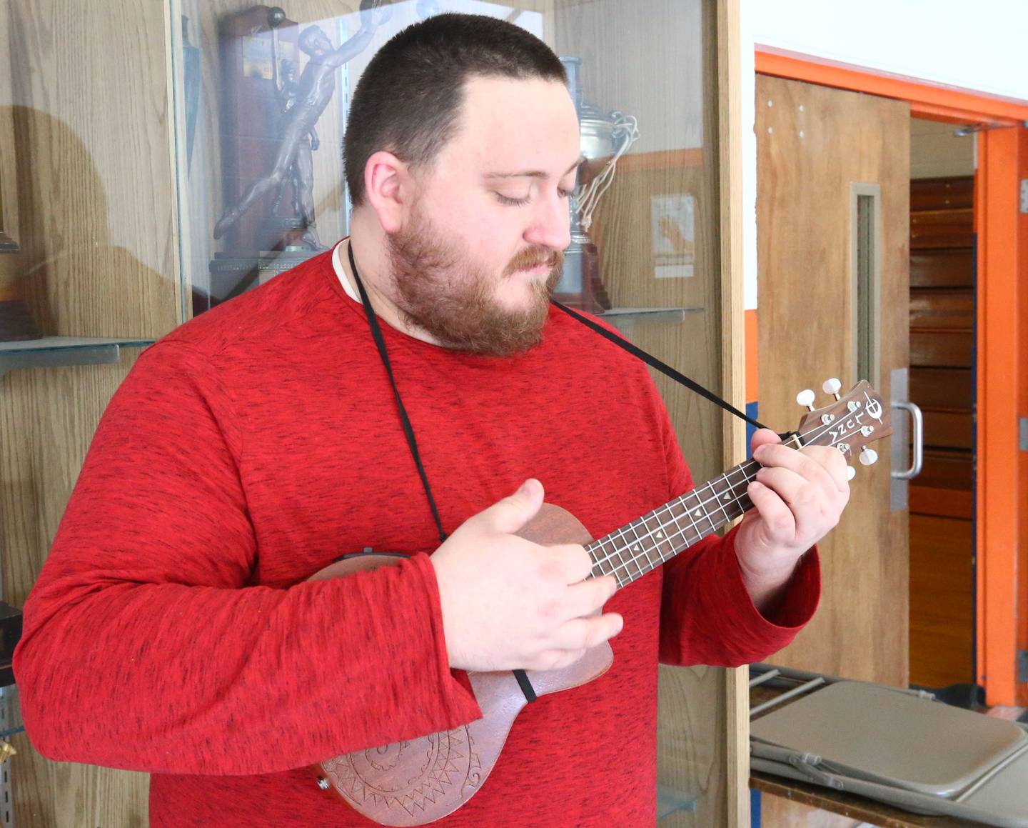 DePue music teacher Sam Miller, plays a ukulele at DePue School on Thursday, March 31, 2022 in DePue.