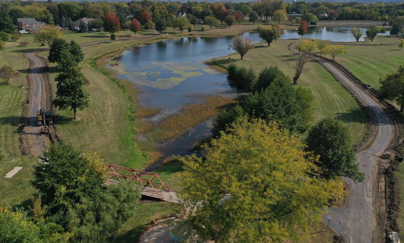 An aerial view of the walking path around Baker Lake on Monday, Oct. 13, 2025 in Peru. Crews are replacing the old walking path with a new one. The Peru City Council approved of the project last month. Gillan Construction out of Cherry was the winning bid to do the project for just under $300,000. The city will use a credit from Mertel Gravel of about $200,000 to pay for materials.

The resurfacing work will include a 10-foot wide concrete path with secondary concrete paths also added, connecting with the new parking lot near Lighted Way and connecting with the parking lot, playground, and shelter on the west side of Baker Lake. The park is closed to the public until early December.