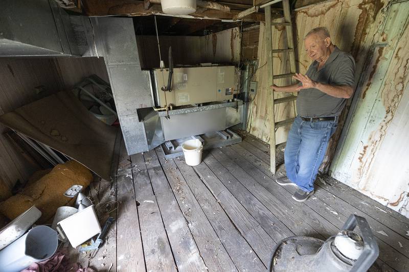 Heerdt gestures where the stone sat for many years in the church’s bell tower.