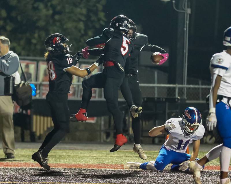 Glenbard East's Gianbiagio Brusca (3) celebrates a touchdown reception during football game between Glenbard South at Glenbard East.   Oct 13, 2023.