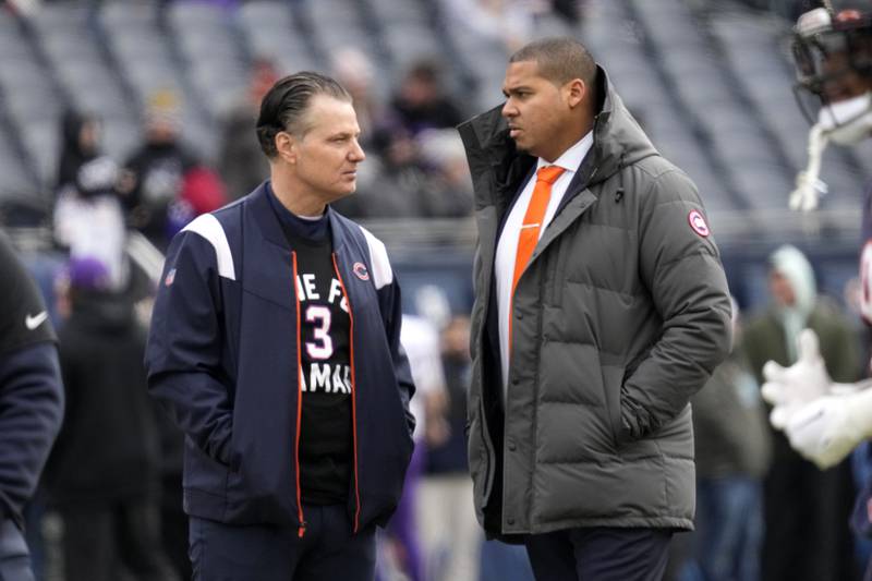 Chicago Bears head coach Matt Eberflus (left) talks with general manager Ryan Poles before an NFL football game against the Minnesota Vikings, Sunday, Jan. 8, 2023, in Chicago.