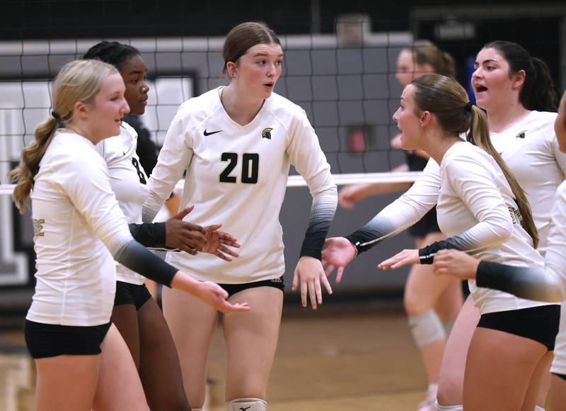 Sycamore players celebrate a point during their match Tuesday, Sept. 30, 2025, at Kaneland High School in Maple Park.