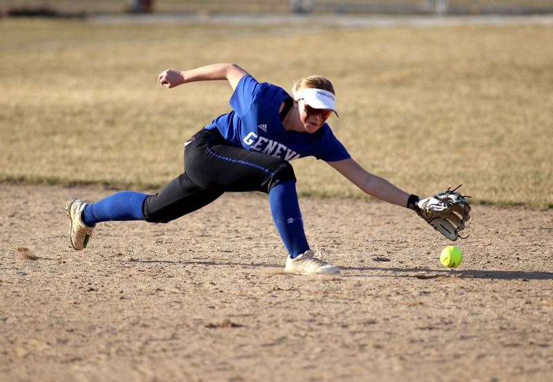 Geneva’s Brianna Venditti reaches for a ground ball during a game at West Aurora during a home game on Wednesday, March 16, 2022.
