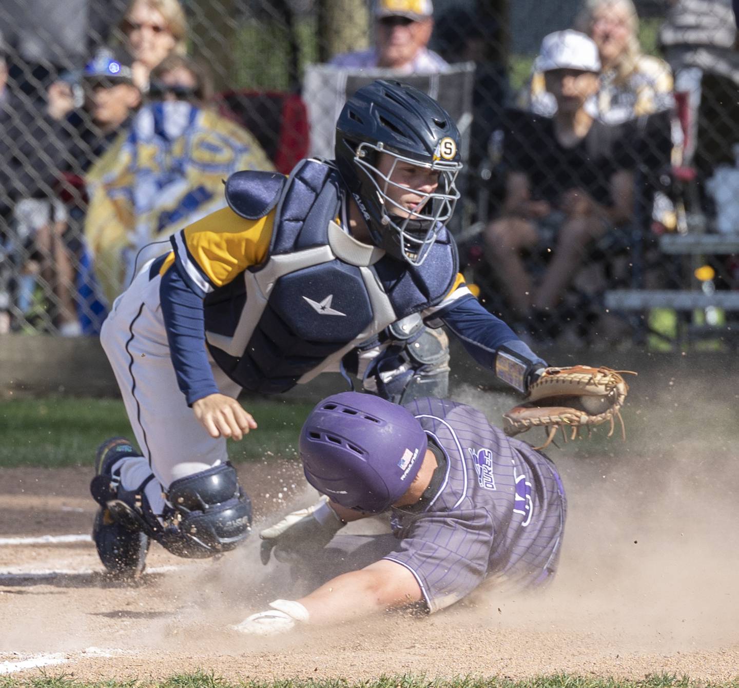 Sterling’s Lincoln Davis tags out Dixon’s Jack Redell Friday, May 23, 2025.
