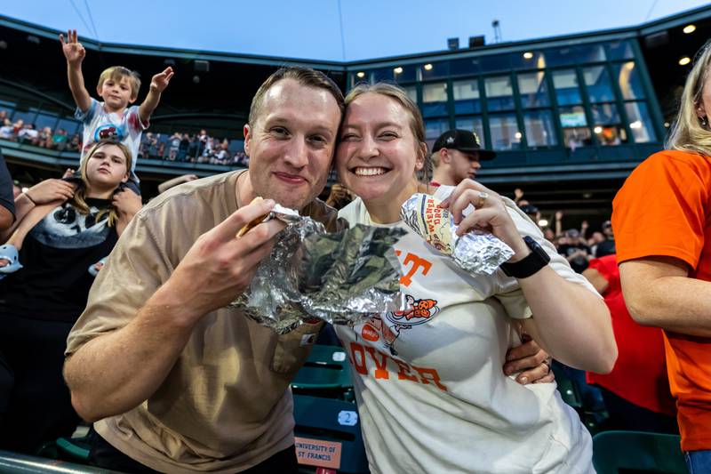 Bill and Clarissa McKnabb, of Saint Francis University, enjoy a pair of hot dogs following the Wiener Drop World Record Attempt, sponsored by Pabst Light, at Duly Heath and Care Field on July 22, 2025.
