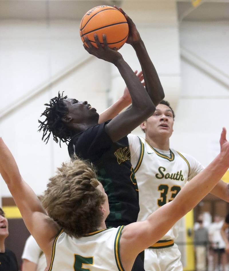 Waubonsie Valley’s Moses Wilson soars to the hoop against Crystal Lake South during Hinkle Holiday Classic varsity boys basketball tournament title game action on Friday, Dec. 27, 2024 at Jacobs High School in Algonquin.