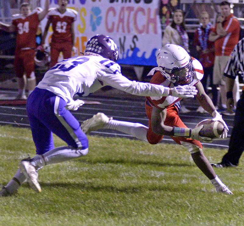 Streator’s Isaiah Brown tries to get into the end zone as Manteno Tyson Clodi tries to stop on a run in the 1st quarter Friday at Streator.