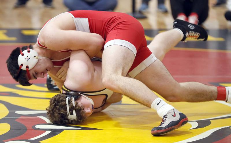 Marko Ivanisevic of Hinsdale Central wrestles Lucas Rentzler of Jacobs at 220 pounds during the Batavia wrestling invite Saturday January 14, 2023 in Batavia.