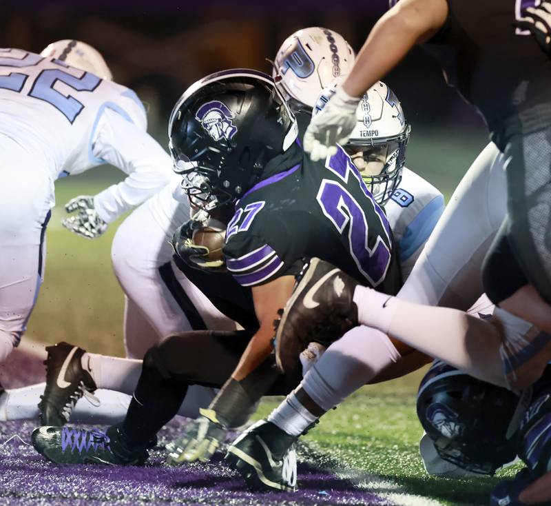 Downers Grove North's Kevin Jay Jr.  (27) goes in for a touchdown during the IHSA Class 7A playoff football game Friday, Oct. 31, 2025 in Downers Grove.