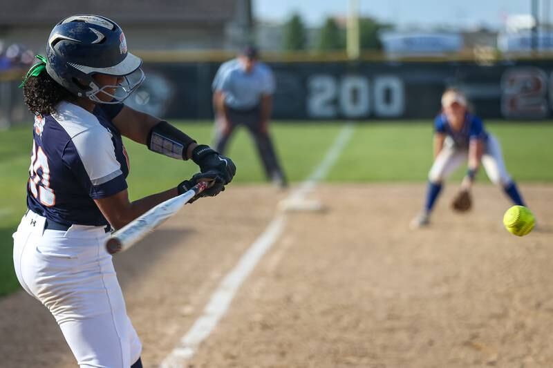 Oswego's Jaelynn Anthony (20) swings at at pitch which resulted in the winning run in their Class 4A Plainfield North Sectional final softball game against Wheaton North. May 31th, 2024.